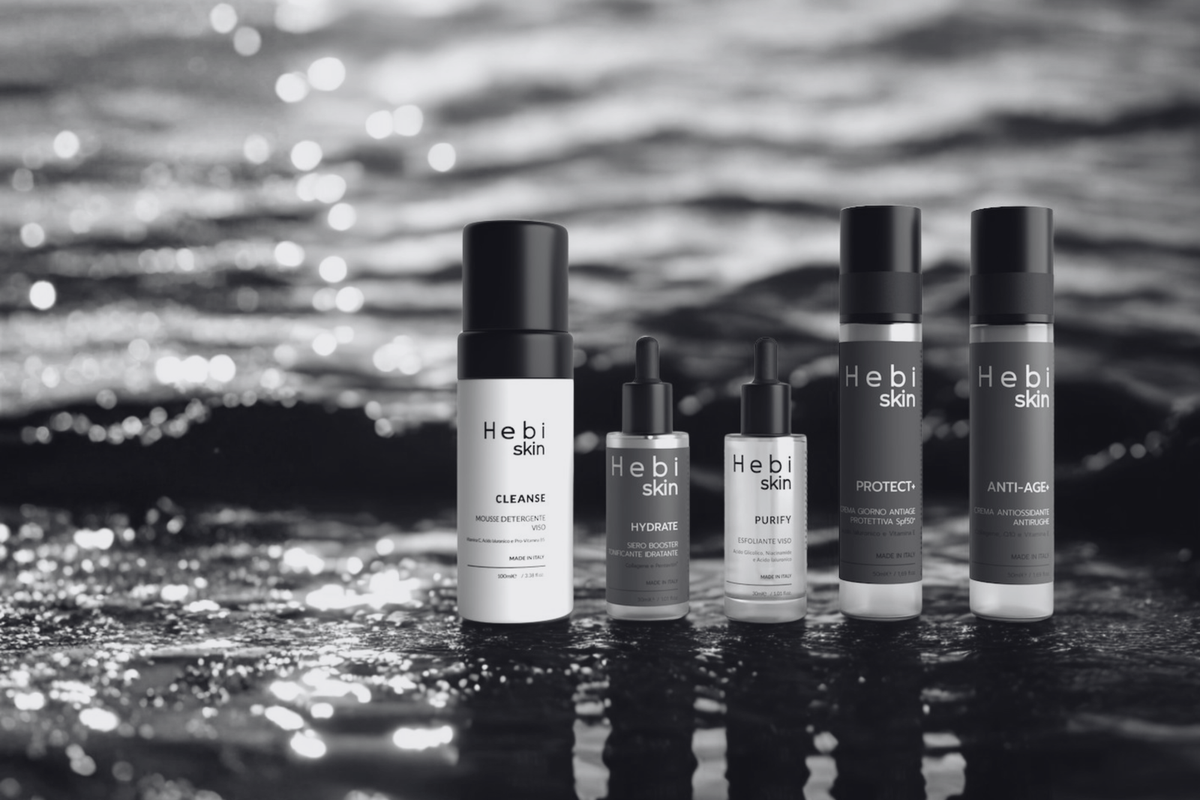 Linea completa 5 prodotti HBSKN — Hebi Skin su sfondo acqua: CLEANSE, HYDRATE, PURIFY, PROTECT+, ANTI-AGE+